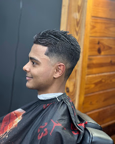 Textured crop haircut with low fade by Shaddai Barbershop in Dunnellon, FL