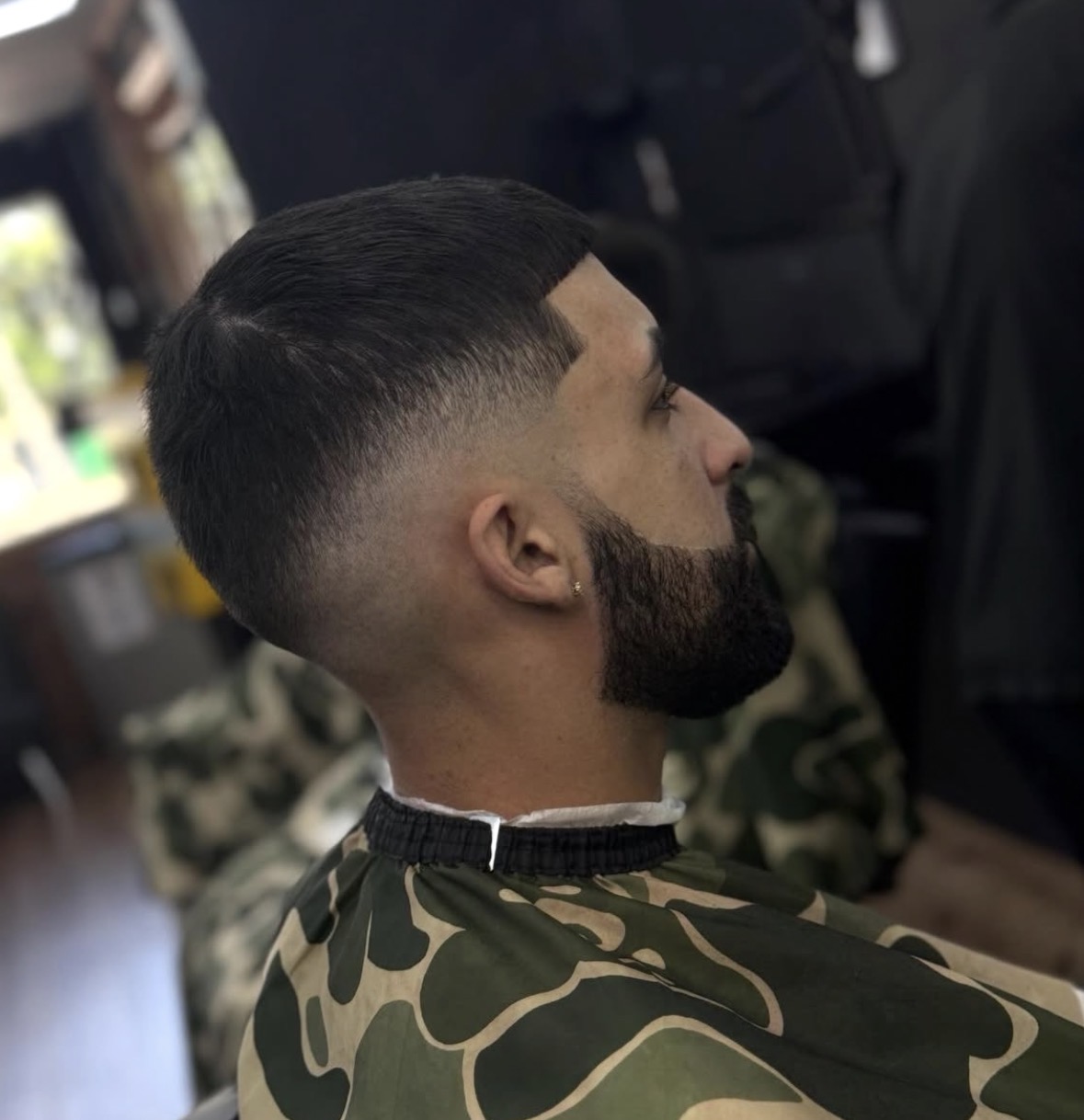 Sharp fade haircut by Shaddai Barbershop in Dunnellon, FL